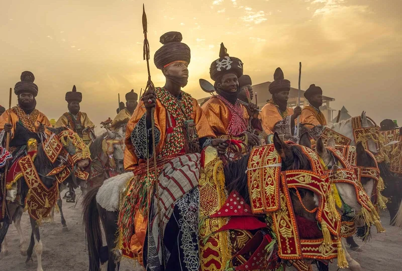 "Traditional horsemen dressed in colorful regalia at Nigeria's Grand Durbar, a UNESCO Cultural Heritage event, supported by Lery Hago Travels."