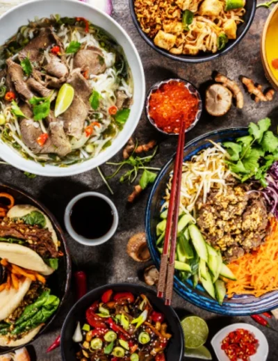 "An array of vibrant international dishes including pho, curry, and salads representing diverse culinary cultures, featured at Africa’s 2nd gastronomy tourism forum, with Lery Hago as a key promoter."