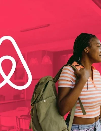 "A young woman with a backpack standing next to the Airbnb logo, symbolizing travel opportunities, including the 2025 travel grant to support elite athletes."