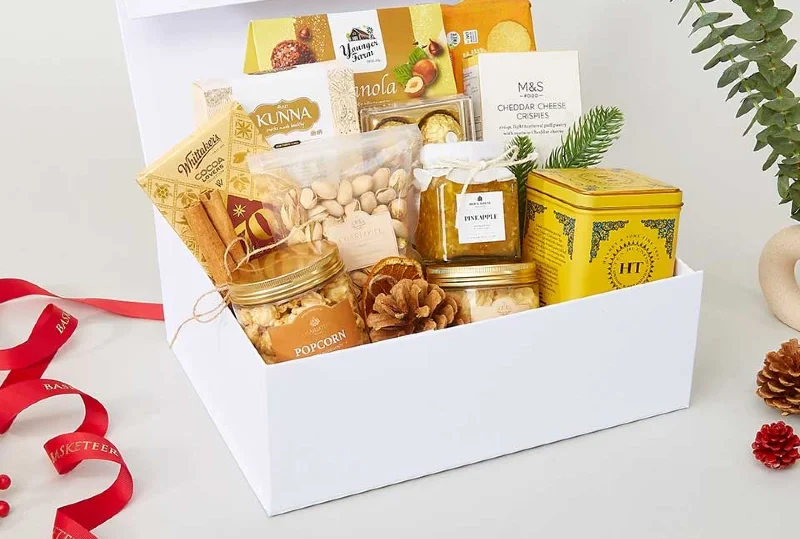 "A premium gift basket featuring popcorn, nuts, pineapple jam, tea, crackers, and gourmet treats, curated as a top souvenir idea by Lery Hago Travels."