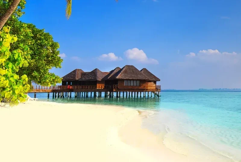 "Overwater bungalows surrounded by turquoise waters and white sandy beaches in the Maldives, a top destination with 2 million tourists welcomed in 2024."