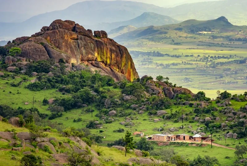 "A scenic view of the green granite hills and rural landscape in Eswatini, Southern Africa"