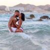 "A couple sharing an intimate moment in the sea, celebrating love with Lisbon Cultural Getaway - leryhago.com"