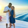 "A couple shares a sunset embrace on a yacht against the backdrop of the calm Maldivian sea, symbolizing the timeless beauty of a romantic villa stay in the Maldives. Plan your journey at www.leryhago.com."