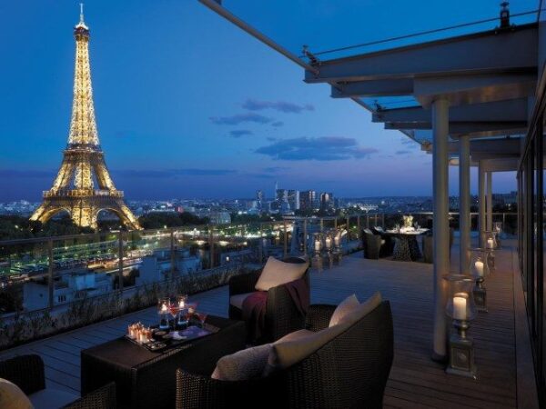 "Rooftop dining overlooking the Eiffel Tower, the perfect setting for a Paris Love Getaway, experiences curated at www.leryhago.com."