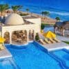 "Aerial view of a luxurious seaside resort in Egypt, with a stunning pool leading to the Red Sea, perfect for an Egyptian Romantic Adventure with www.leryhago.com."