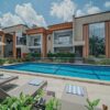 "Chic holiday villa with a shimmering pool, an elegant retreat in the Christmas Kigali Nairobi Package"