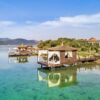 "Overwater bungalows with thatched roofs in Turkey, offering a secluded retreat on www.leryhago.com's Romantic Turkey Tour."
