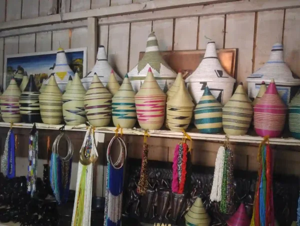 "Artfully displayed Rwandan handcrafted baskets and colorful beaded jewelry, epitomizing the vibrant Rwanda Radiance - unique finds at www.leryhago.com."
