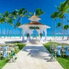 Wedding setup on the beach with the sea and palm trees in the background in Punta Cana