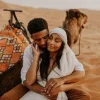 A couple in one of the iconic landmarks in Marrakech, Morocco - The Desert Safari.