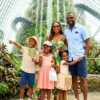 An african family taking a picture in the cloud garden in Singapore