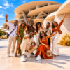 A group of african tourists taking a picture in front of the National Museum of Qatar, Doha