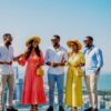 A group of stylishly dressed Africans taking a picture